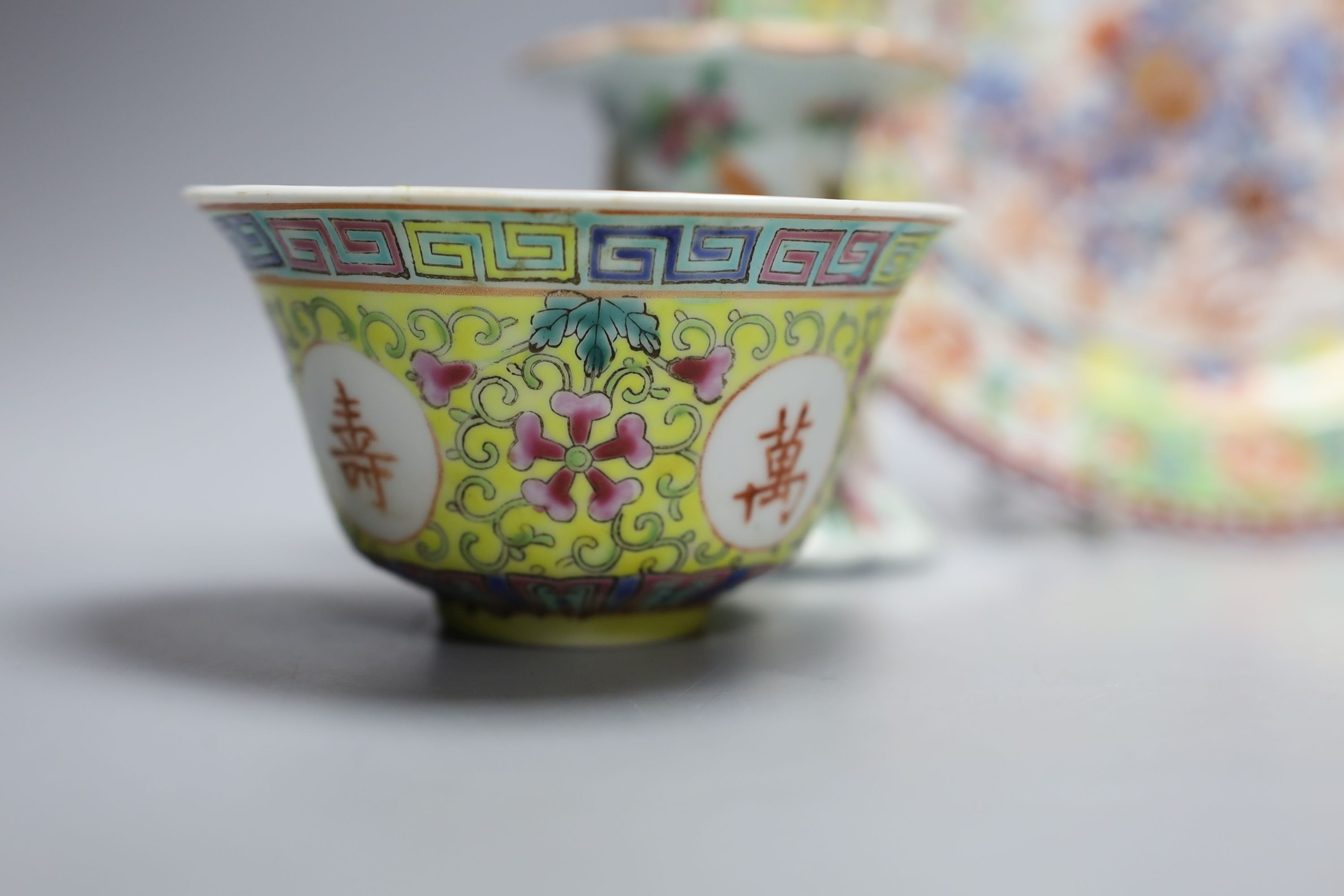 A Chinese yellow ground ‘dragon’ stem cup, a clobbered dish and two other pieces